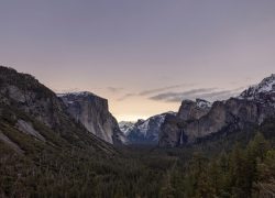 Captivating twilight scenery in Yosemite Valley with iconic rock formations and winter hues.
